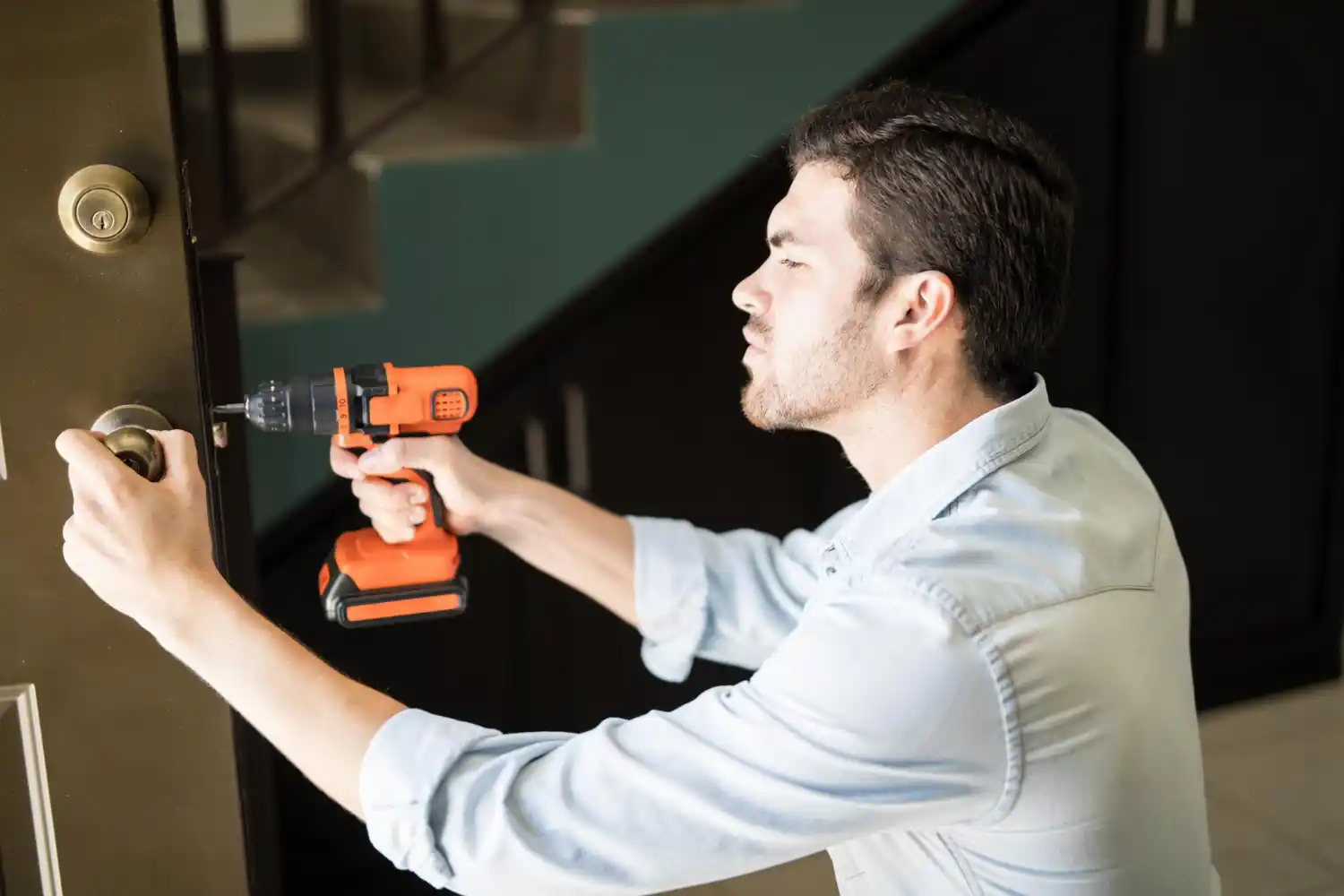 Professional locksmith in Nokomis, FL unlocking a residential front door